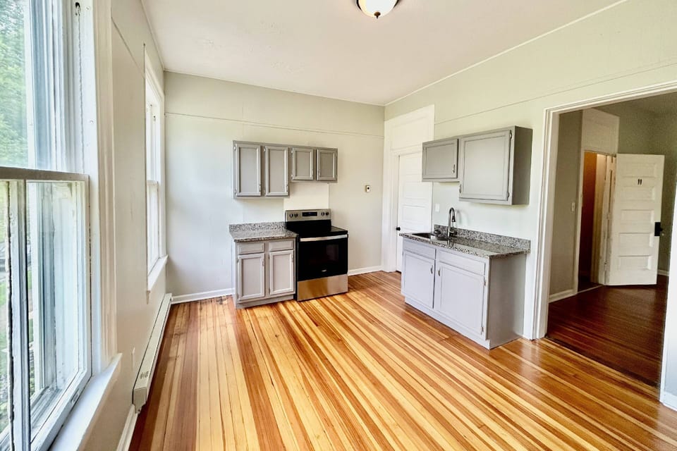 Kitchen area looking into living room - walk-in pantry is to the right of the stove