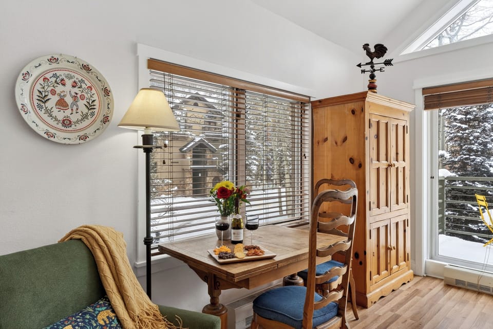 Intimate wooden dining table for two.