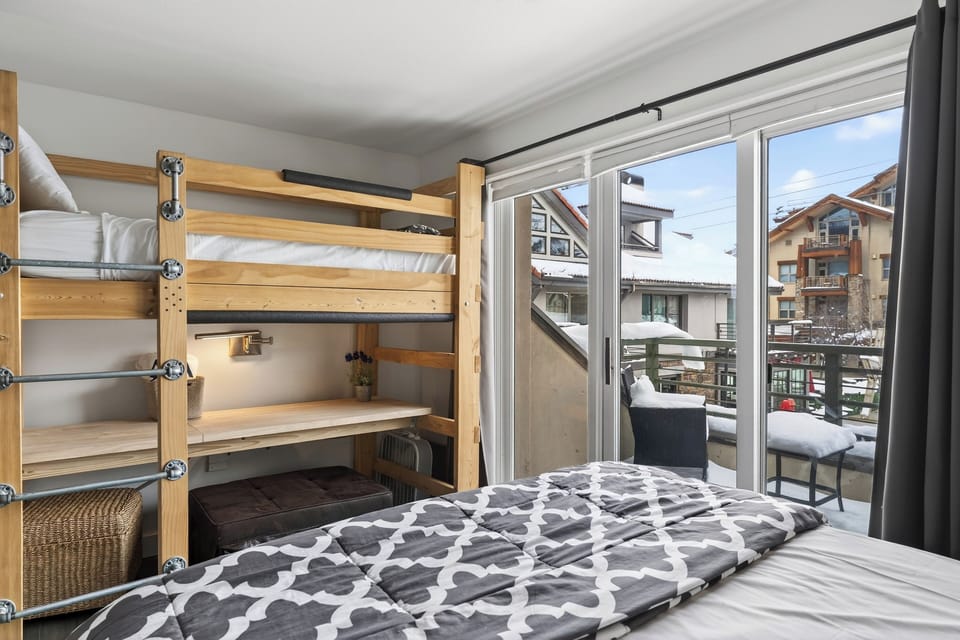Loft bed and the snowy exterior view.