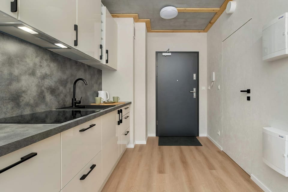 Kitchenette with entrance door.