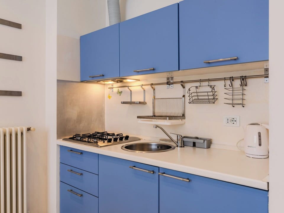 Kitchen, Major Appliance, Countertop, Kitchen Appliance, Kitchen Sink, Kitchen Stove, Interior Design, Cabinetry, Flooring, Stove