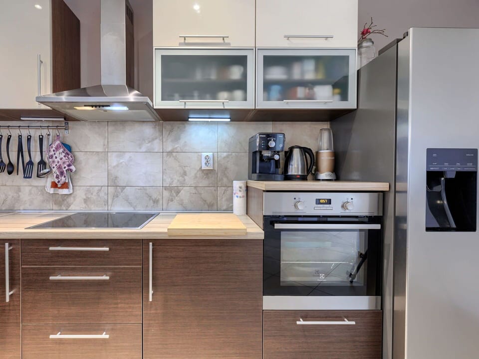 Kitchen Appliance, Kitchen, Cabinetry, Countertop, Furniture, Major Appliance, Home Appliance, Flooring, Interior Design, Wood
