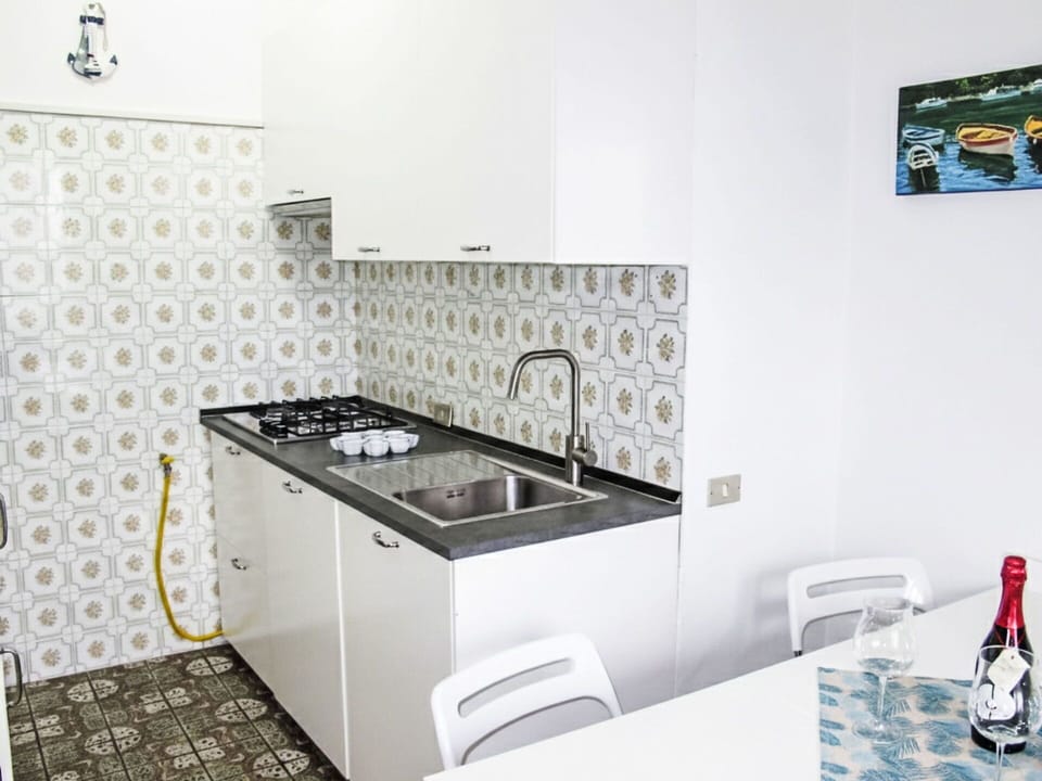Kitchen, Kitchen Appliance, Major Appliance, Flooring, Interior Design, Countertop, Floor, Kitchen Stove, Plumbing Fixture, Tap