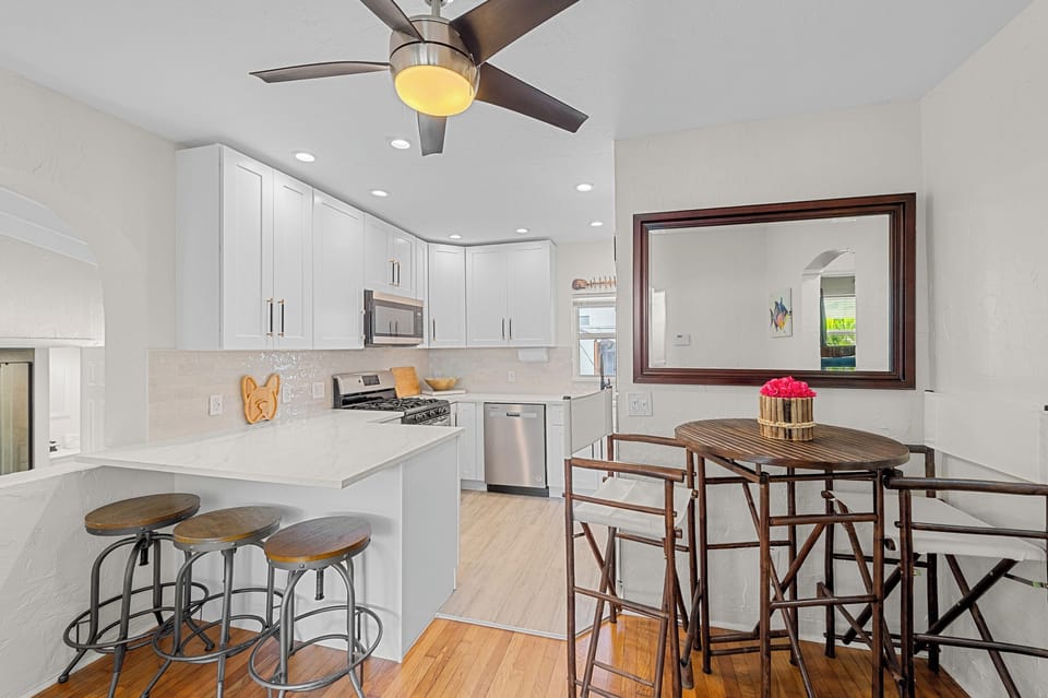 Kitchen: Bright and airy space perfect for culinary adventures and morning coffee by the window!