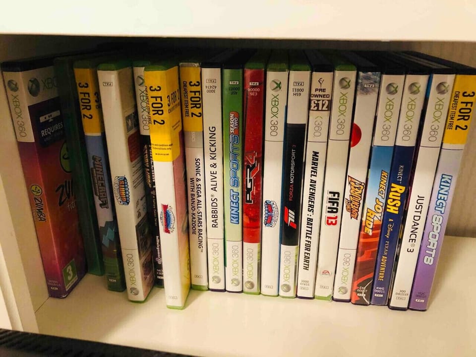 Pick a film or game from the shelf of boxed titles.