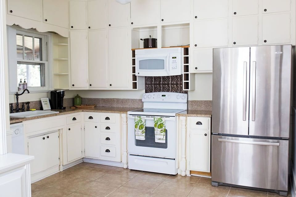 Equipped kitchen with modern appliances, perfect for preparing meals.