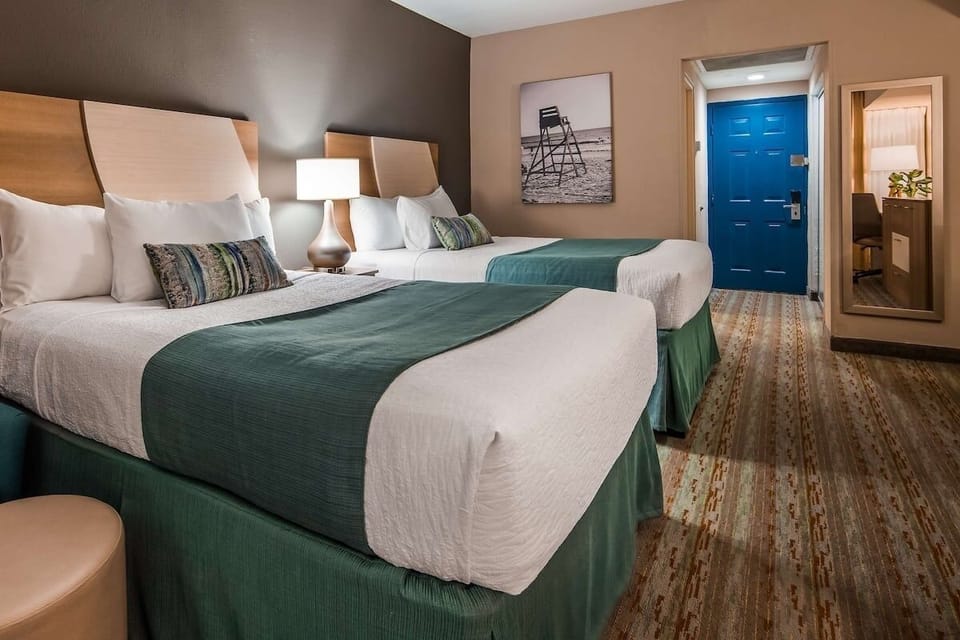 Drift off comfortably in a spacious room with calming tones.