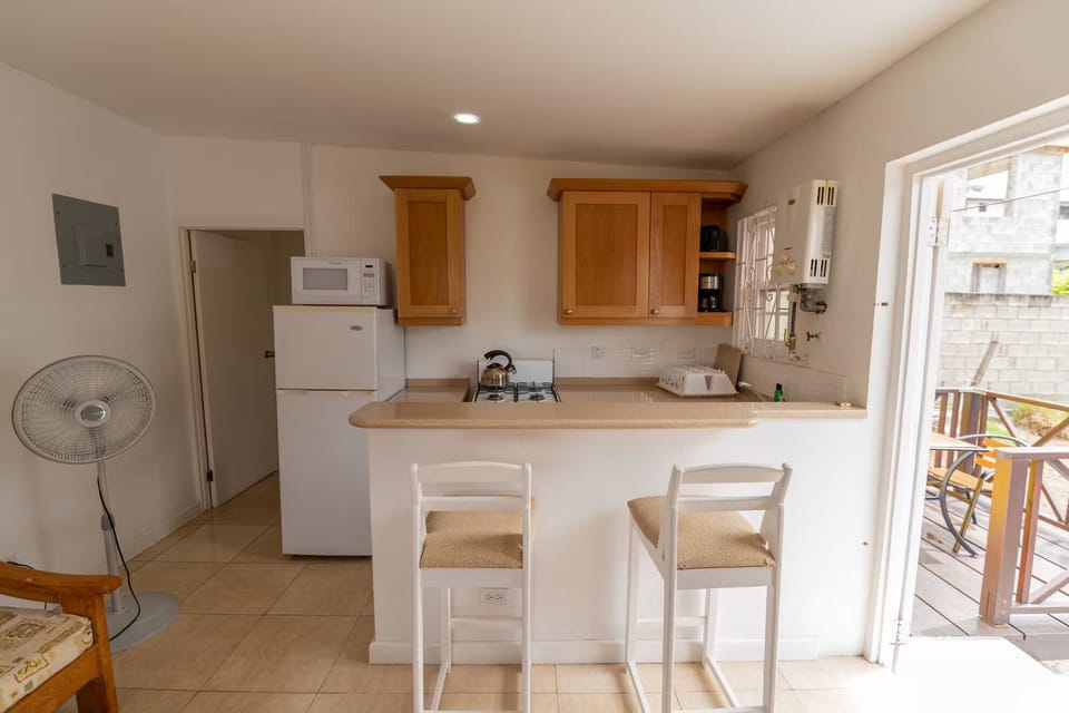Start mornings with coffee beside the sunny breakfast bar.