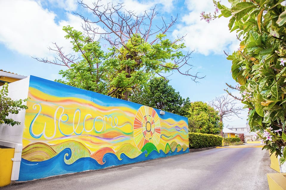 Arrive smiling to a colorful mural and easy driveway access