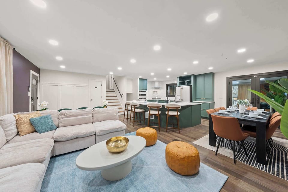 Open-concept living room w/ comfortable seating & seamless flow into the dining area.