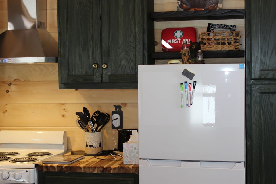 Full kitchen. Stove, refrigerator and all cooking supplies