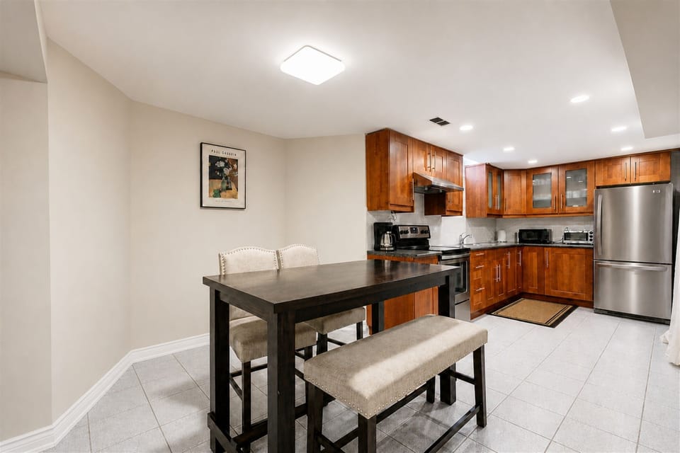 Bright kitchen with stainless steel appliances and cozy dining space