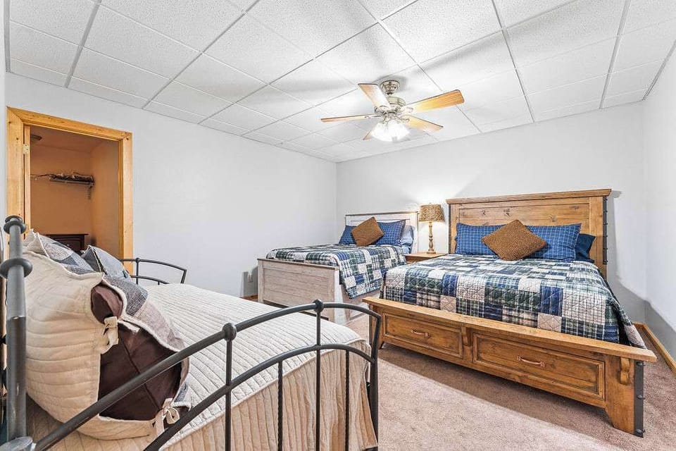 Lower level bedroom with a queen, full and two twin bedrooms.