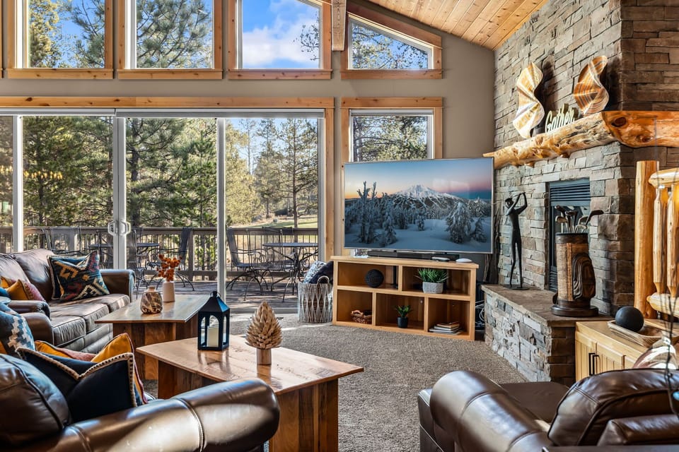 Open living with view of Woodlands Golf Course at The Masters Lodge