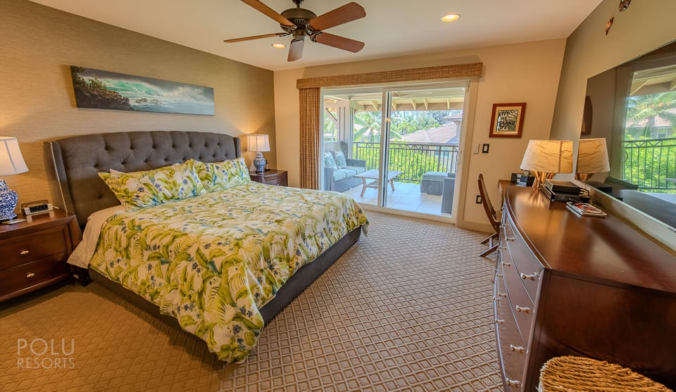 Unwind in a serene king suite with breezy lanai views.