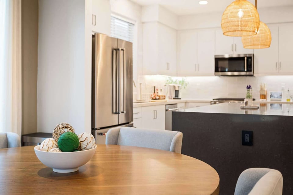 Open-concept living area connecting seamlessly to the fully equipped kitchen