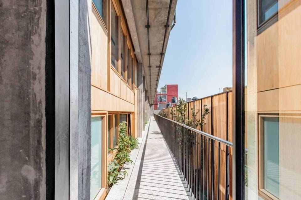 Experience the unique architectural design along our serene outdoor walkway.