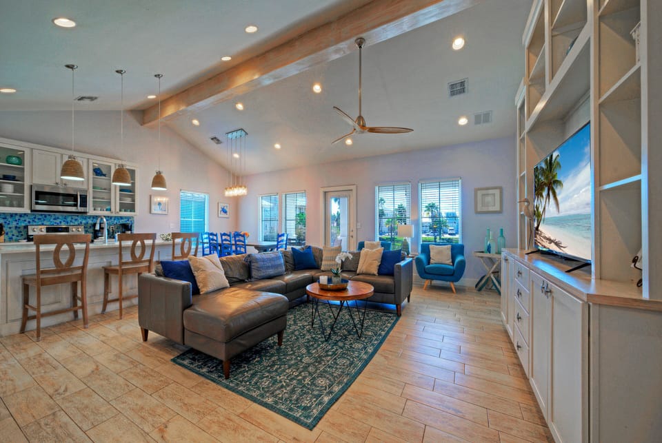 Spacious open-concept living room with coastal decor.