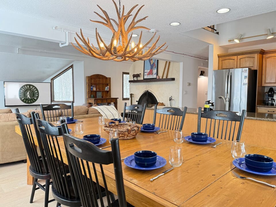 Gather the whole group around our large wooden dining table, set beneath a striking antler chandelier.