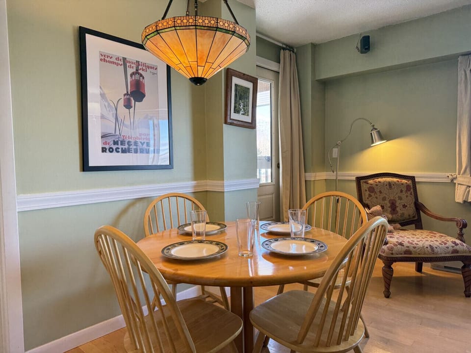 Enjoy intimate meals at this round wooden dining table