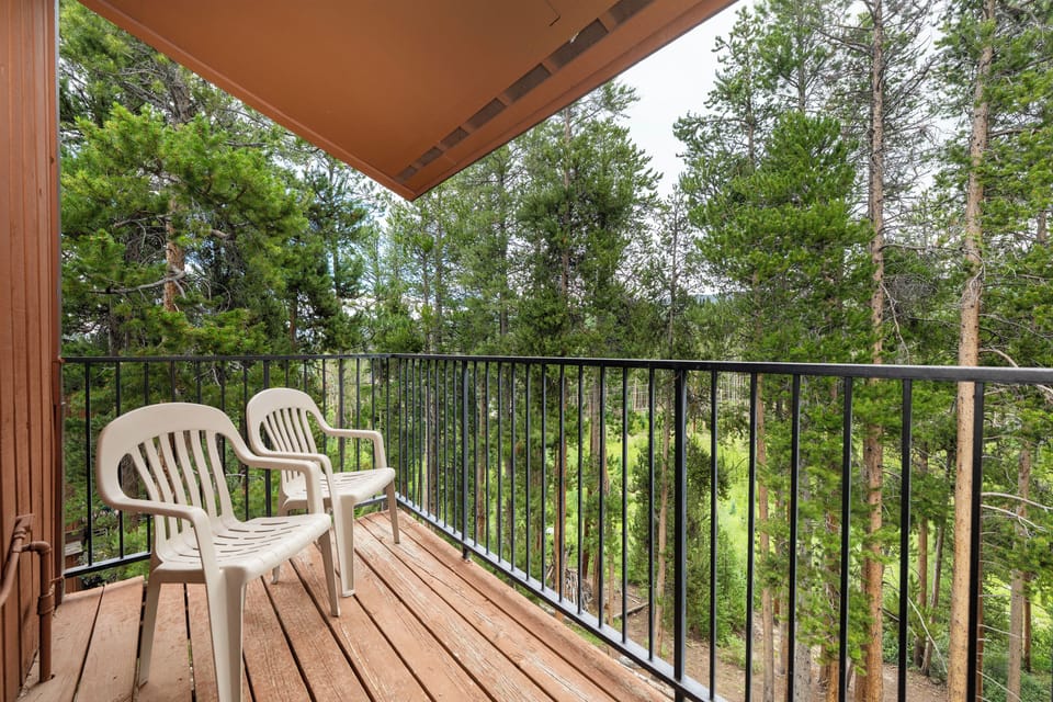 Relax on your private balcony with forest views, where morning coffee tastes better surrounded by towering trees and peaceful nature.