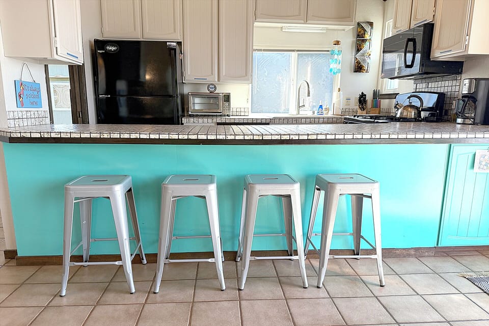 The breakfast bar is great for hanging out - with your favorite chef