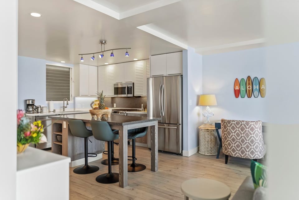 Your modern kitchen features sleek appliances, spacious island seating, and stylish finishes perfect for cooking memorable meals together.