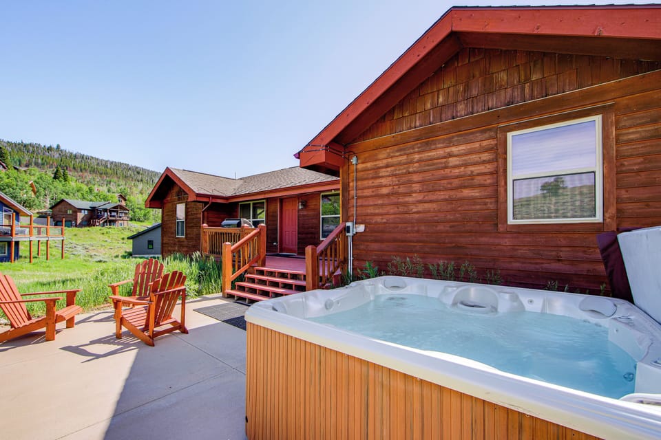Soak in your private hot tub while gazing at forested mountains, then relax in Adirondack chairs on your spacious patio.