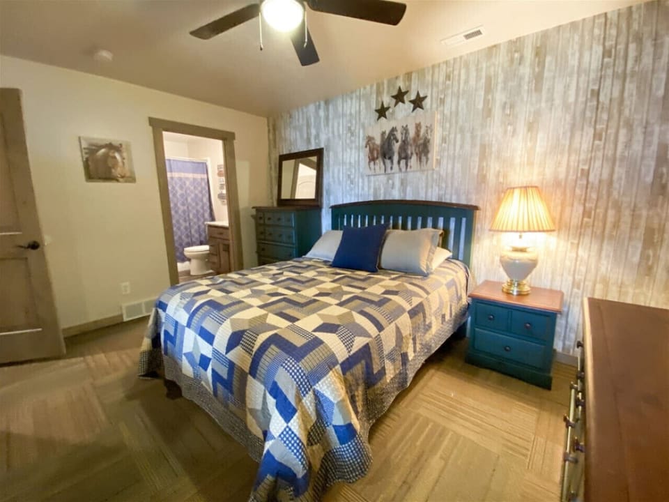 queen bedroom with rustic charm and private en-suite for a peaceful, restful retreat.