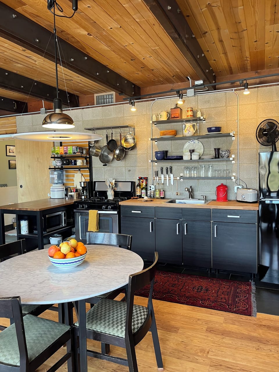 Dining table and kitchen.