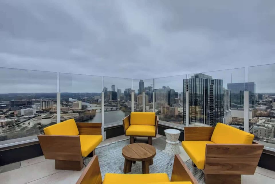 Rooftop pool with panoramic views and relaxed seating.