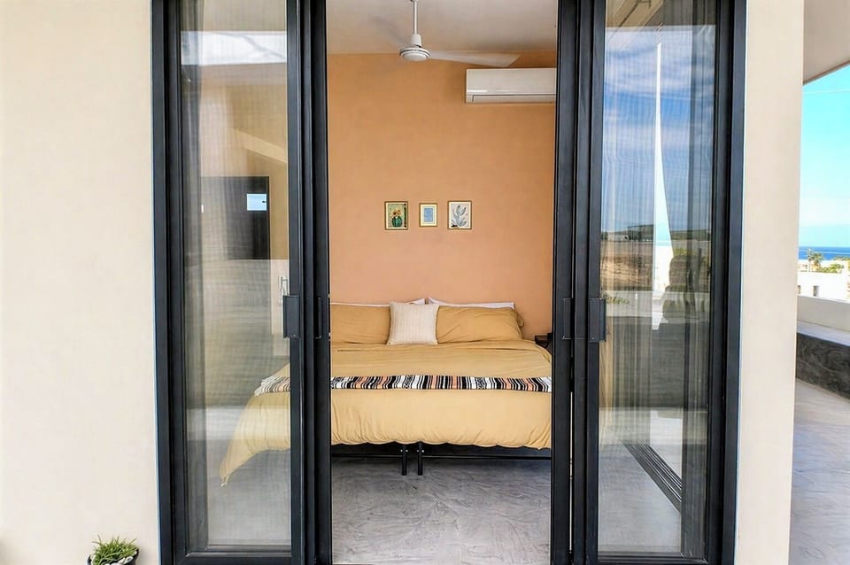Upstairs bedroom with king bed | Air conditioning | Ceiling fan | Clothing storage | Hangers