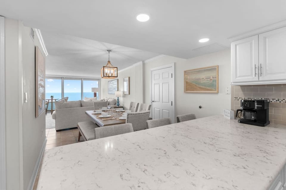 Spacious kitchen island perfect for morning coffee, meals, and gathering before the beach.