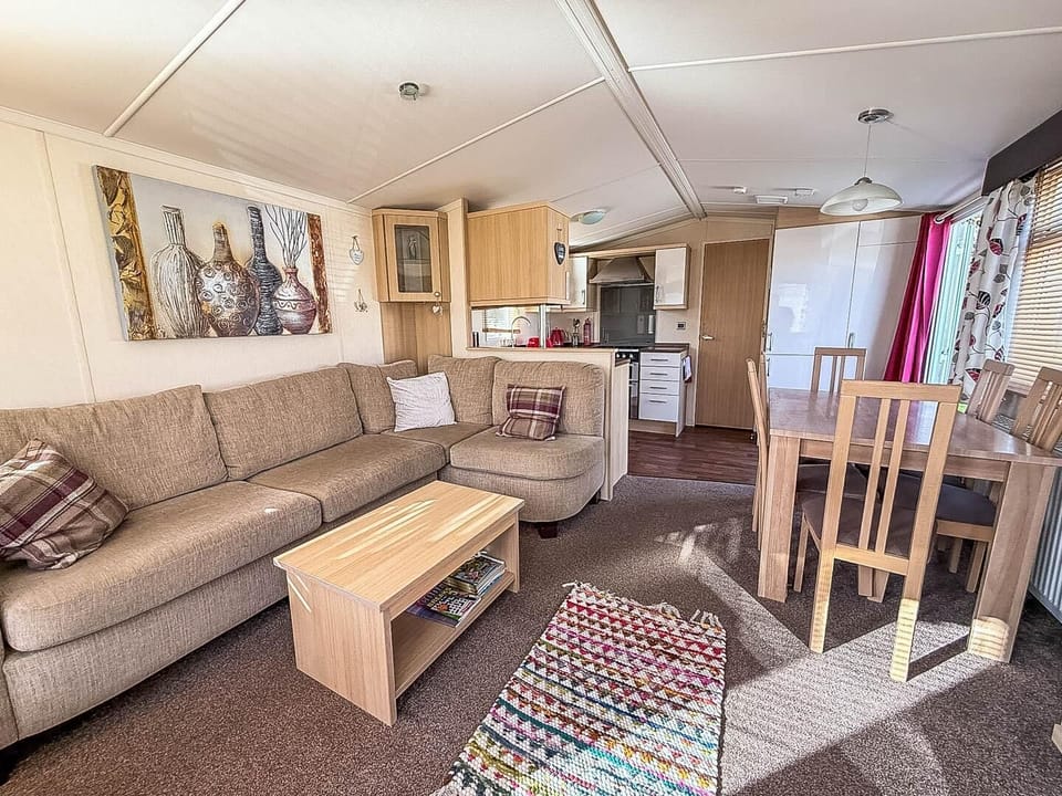 The open plan dining and living room is perfect for dining together or relaxing after a long day. Once dinner is complete get the board games out and get around the table with the whole gang.