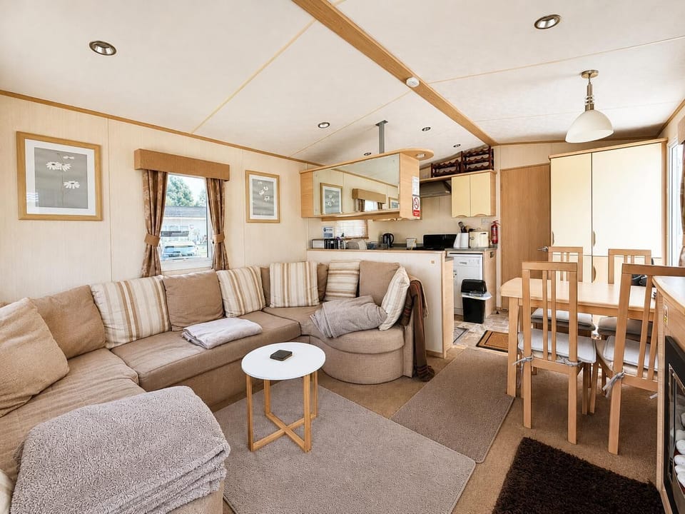 Bright and welcoming lounge area in this 6-berth holiday home at Broadland Marina Holiday Park, perfect for family holidays and relaxing after exploring the Norfolk Broads.