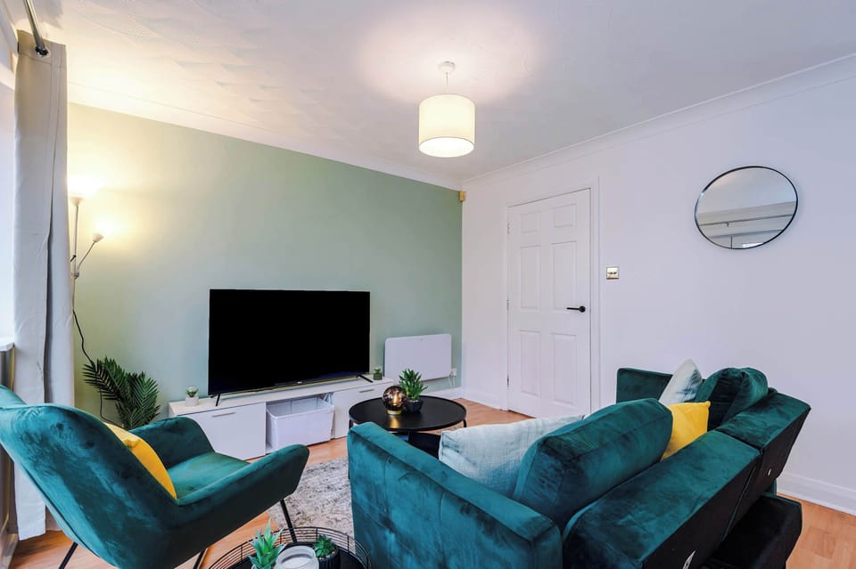 Living Room: Stylish seating and sleek decor create the perfect ambiance for relaxation and fun!