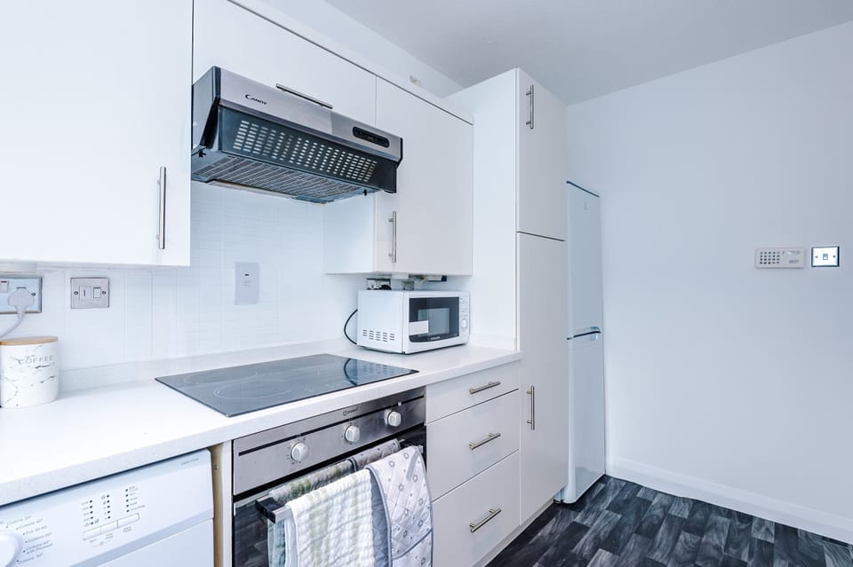 Kitchen Delight: Modern appliances await your culinary creativity in this sleek, functional kitchen!