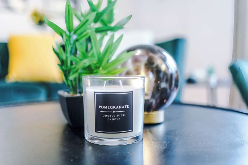 Chic Living Space: Unwind with aromatic ambiance and vibrant decor in stylish comfort!