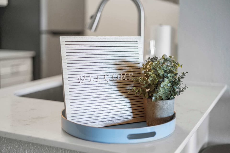 Stylish kitchen counter detail showcasing clean surfaces and thoughtful decorative touches. This well maintained space reflects the home’s modern design and creates a welcoming atmosphere for cooking and everyday living.
