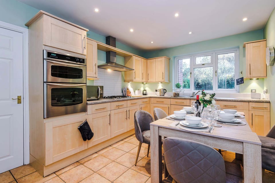 Kitchen Delight: Modern appliances and a sunny dining nook, perfect for culinary adventures!