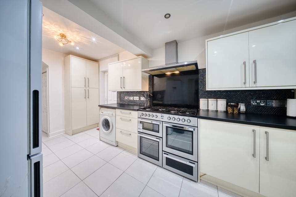 Kitchen: Cook up a storm in this sleek, modern space with stylish appliances and ample storage!