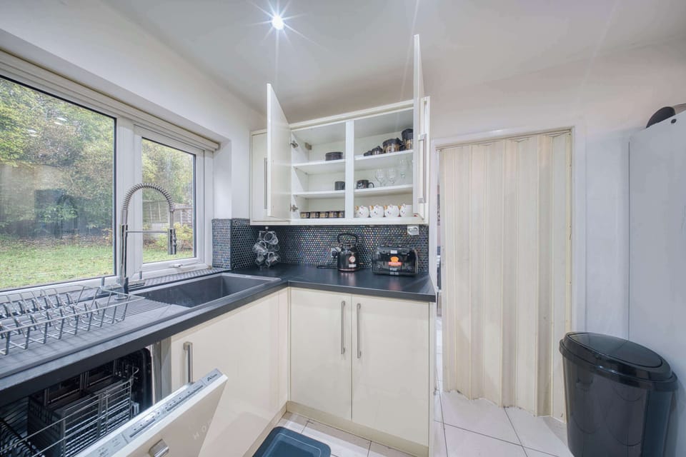 Kitchen Delight: Modern appliances, stylish decor, and scenic views for gourmet adventures!