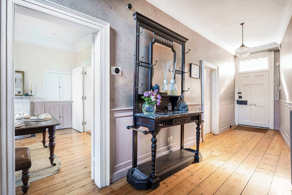 Elegant Entryway: Step into luxury with vintage charm and stylish finishes. Welcome home!