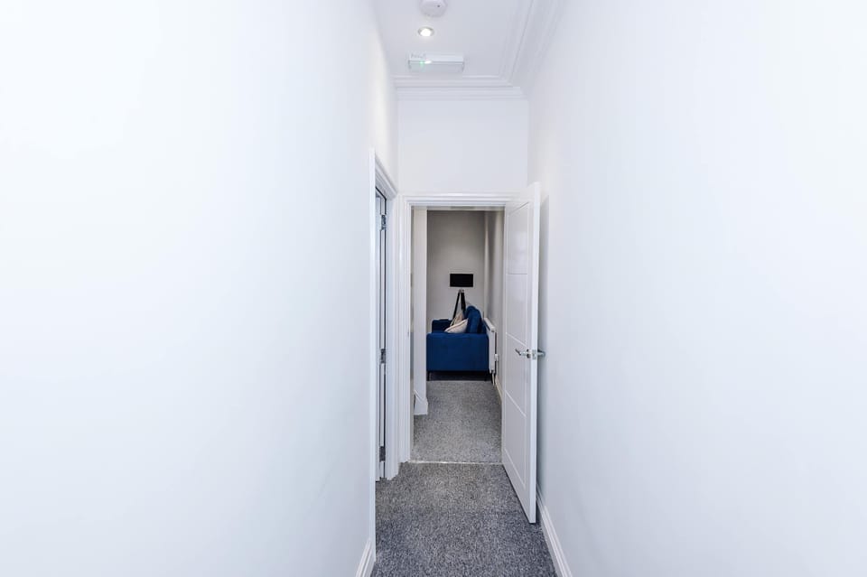 Hallway: Light-filled entry leads to a chic living area—your adventure starts here!
