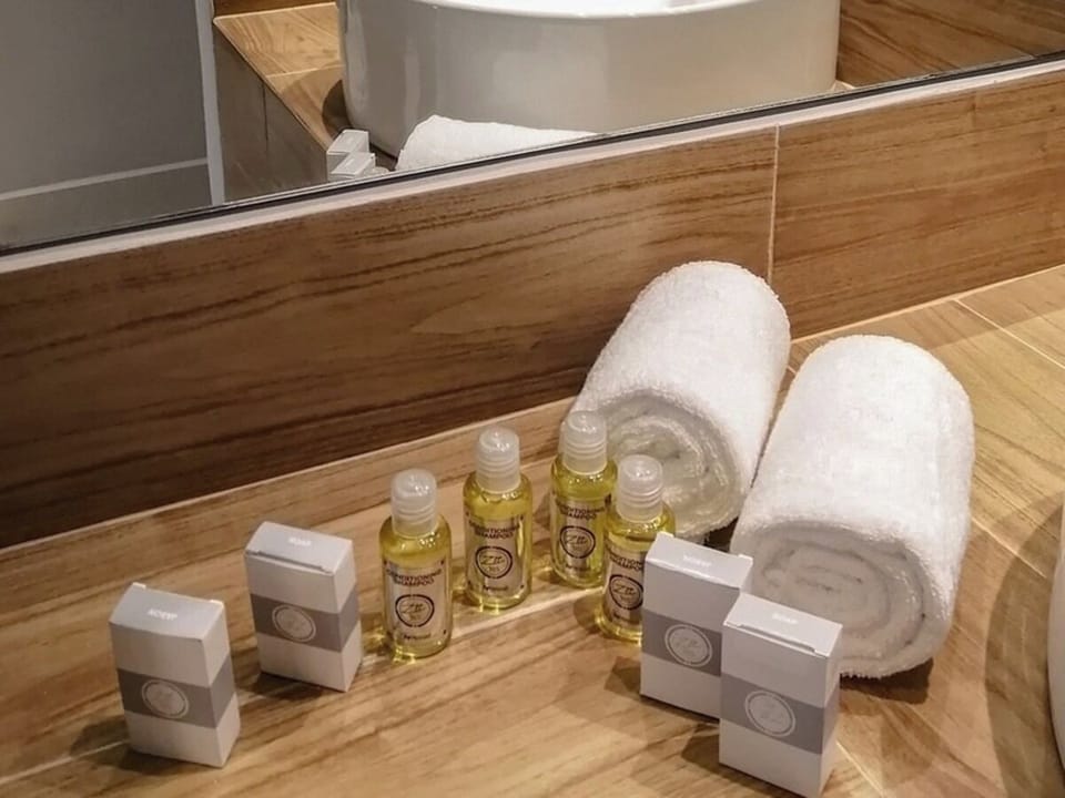 Indulge in fresh towels and toiletries for a spa-like reset.