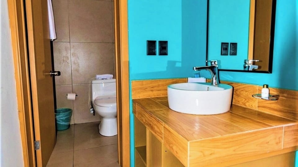 Freshen up quickly with a clean, functional private bathroom.