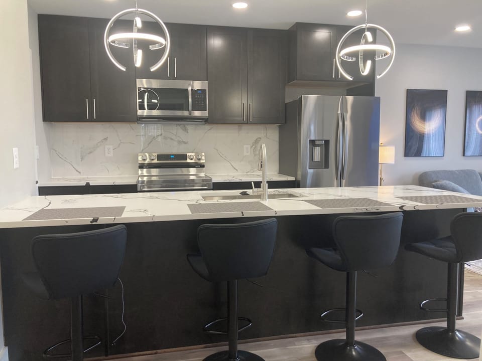4 Counter high chairs serves as dinning space.