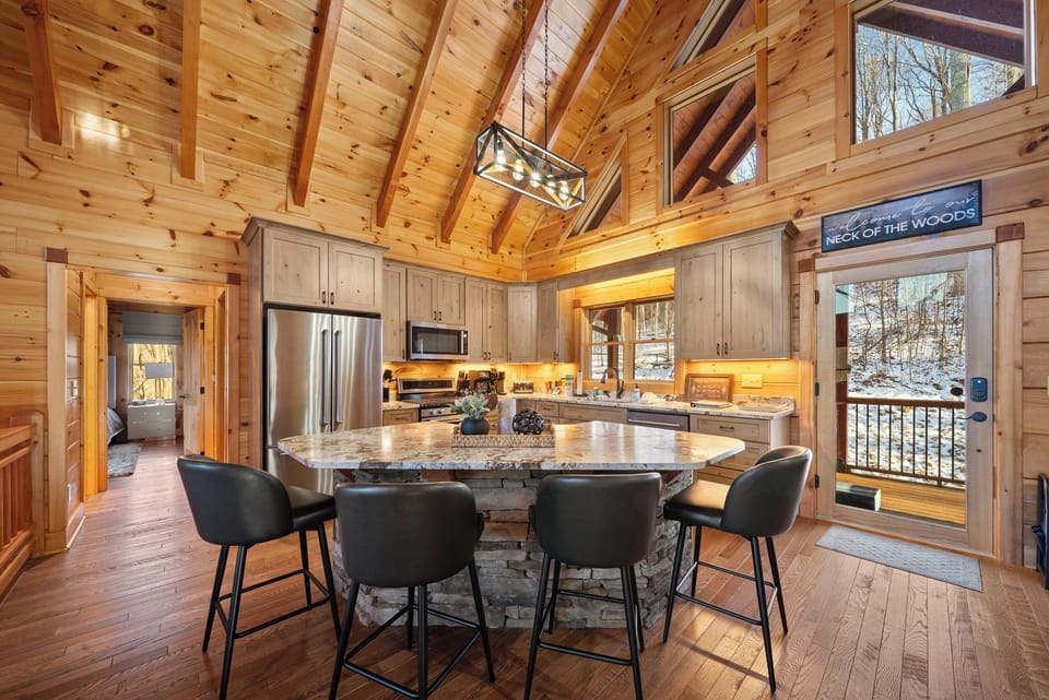 Beautiful Kitchen with Granite Top Center Island and Stone Knee Wall
