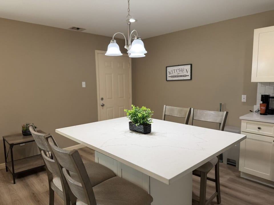 Gather the family around a stunning quartz island — seats four comfortably