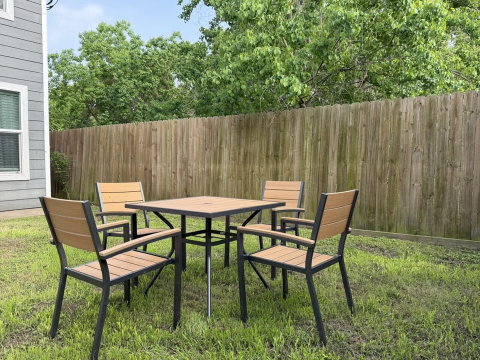 Fenced backyard with outdoor seating — safe outdoor space the whole family will love
